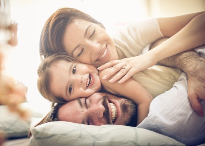Happy family enjoying their new HVAC system